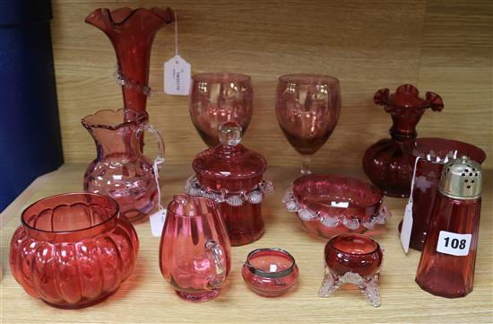 Twelve items of cranberry glassware, H.25cm